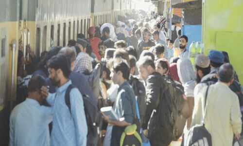Crowds wait at railway station as no special Eid train announced from Pindi