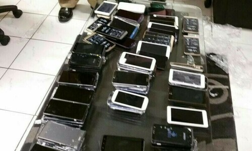 Customs clerk in GB booked for phone smuggling Customs clerk in GB booked for phone smuggling