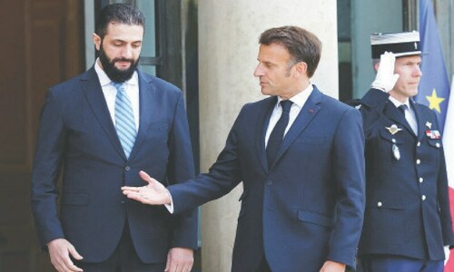 In first European visit, Syrian leader meets Macron
