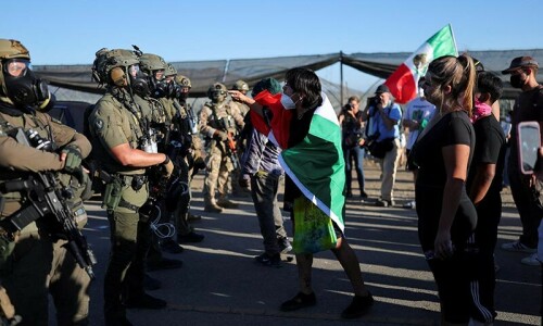US officials defend immigration raid tactics