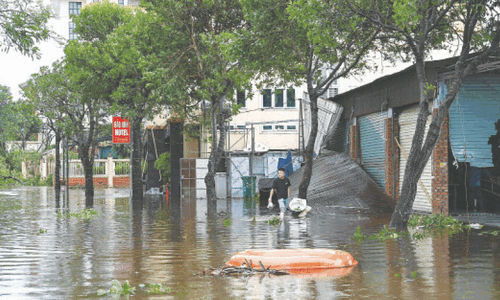 Typhoon kills three in Vietnam, floods streets in Hanoi