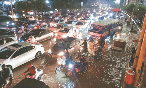 Karachi brought to standstill as rain floods roads, cuts power