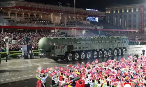 North Korea holds military parade, shows off new intercontinental missile