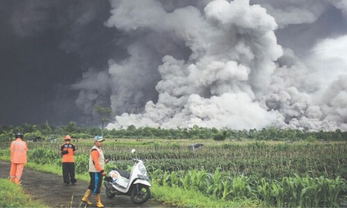 Volcano erupts near Bali, sending ash into the sky