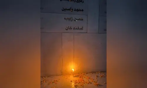 Relatives of APS victims mark 11th anniversary of school massacre with candlelit vigil