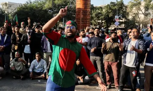 In pictures: Buildings set on fire as violent protests break out in Dhaka following death of wounded youth leader In pictures: Buildings set on fire as violent protests break out in Dhaka following death of wounded youth leader