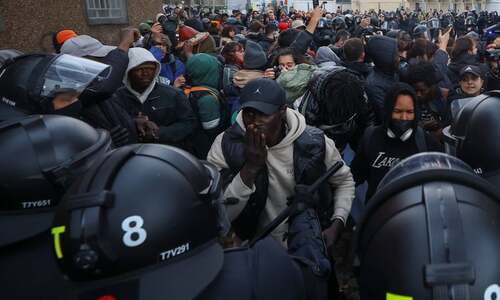 Hundreds of migrants evicted from building  in Spanish city