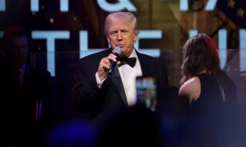 Trump says aspirin caused bruised hand, denies falling asleep