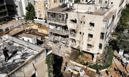 Iran Guards say they fired missiles at Israel and Gulf states; airstrikes hit Tehran