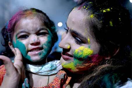 Hindu community celebrates Holi with simplicity