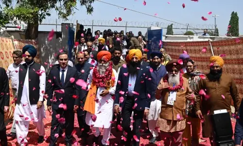 In pictures: Sikh pilgrims arrive in Pakistan from India to celebrate Baisakhi festival