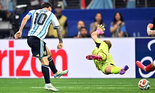 Magic Messi makes World Cup history to send Argentina into last 32