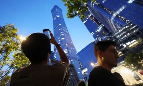 Small aircraft crashes into Beijing's tallest building, eyewitnesses say