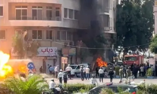 Explosions heard in Damascus during Macron visit, security source says