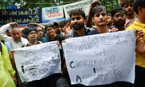 Under soaring pressure after 'cockroach' movement protests, India's education minister promises reforms, debate