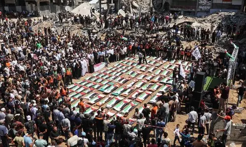 Palestinians mourn 112 people retrieved from rubble in Gaza