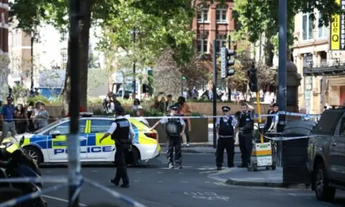 Woman arrested after four men stabbed in London
