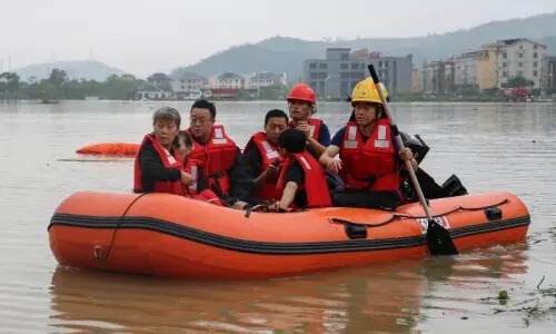 Rain pounds Beijing as Typhoon Dolphin sweeps through China Rain pounds Beijing as Typhoon Dolphin sweeps through China