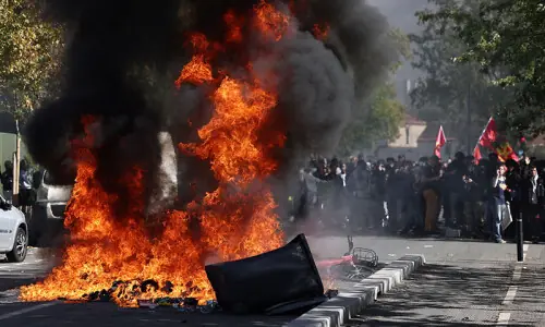 Students torch two schools as protests rage across France