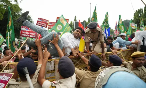 Indian opposition protest police action against lawmakers, push for poll chief's resignation