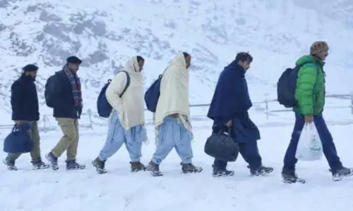 Two killed as rain, snow disrupt life across GB Two killed as rain, snow disrupt life across GB