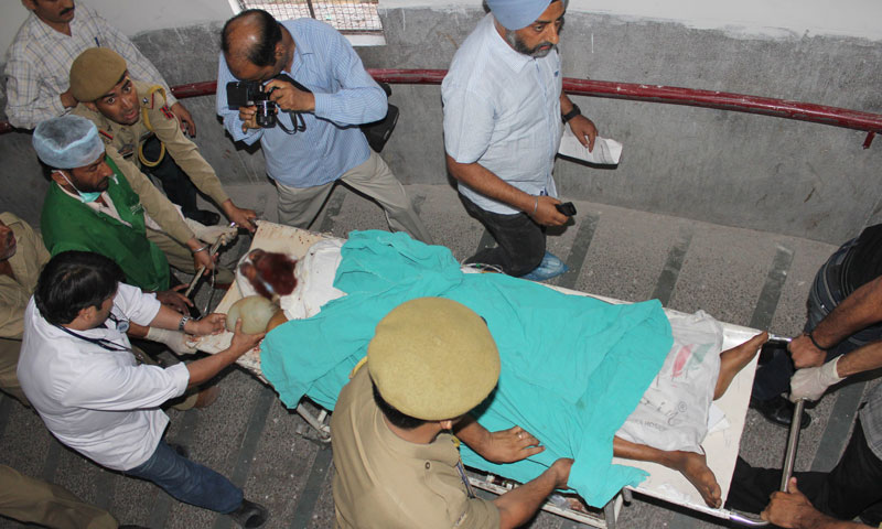 Pakistani prisoner Sanaullah, an inmate of India's central Jammu jail, is shifted to the intensive care unit at a hospital in Jammu on May 3, 2013, after being attacked by Indian inmates at the prison.