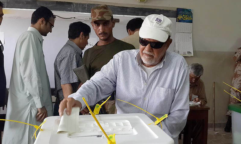 A senior citizen casting his vote at DHA model school Phase IV.— Photos by Saher Baloch