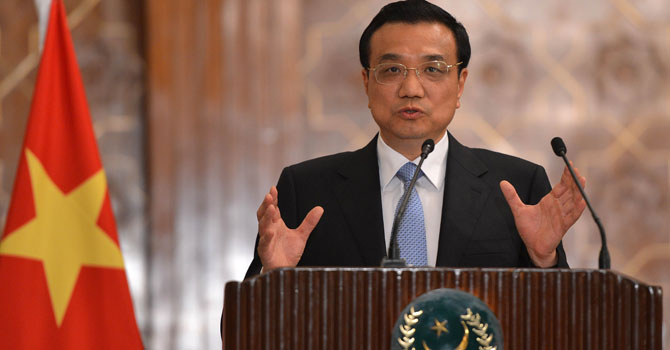 Chinese Premier Li Keqiang gestures during a joint press conference with unseen Pakistani President Asif Ali Zardari at the presidential palace in Islamabad on May 22, 2013. — AFP Photo