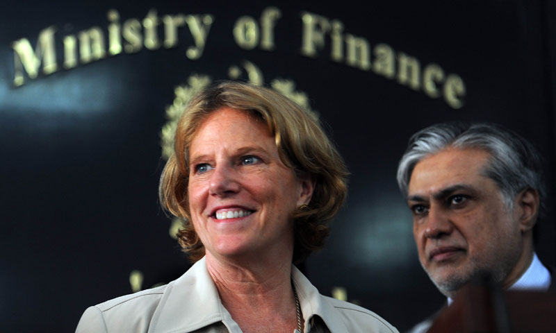 President and CEO of the US Overseas Private Investment Corporation (OPIC), Elizabeth Littlefield (L) is flanked by Pakistani Finance Minister Ishaq Dar as she speaks at a press conference in Islamabad on July 16, 2013. – AFP Photo