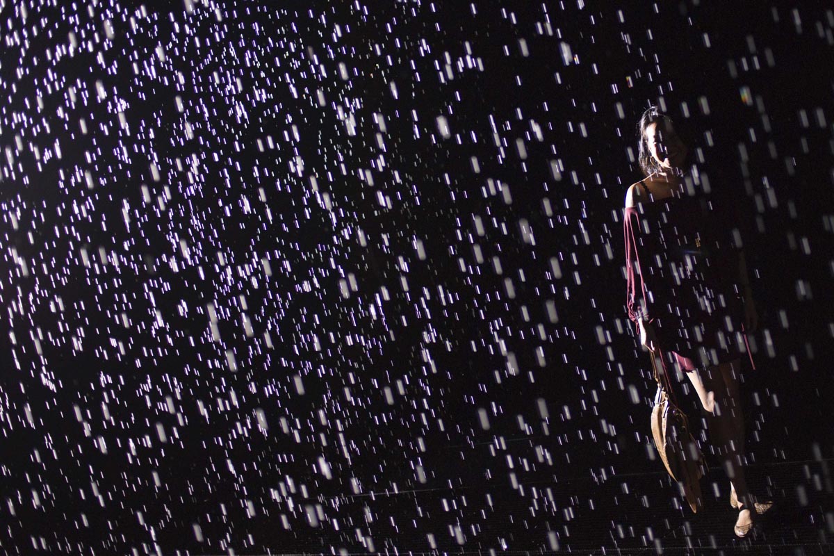 Visitors gather in the new ‘Rain Room’ installation at the Museum of Modern Art (MoMA) in Manhattan on May 15, 2013 in New York City. — AFP Photo