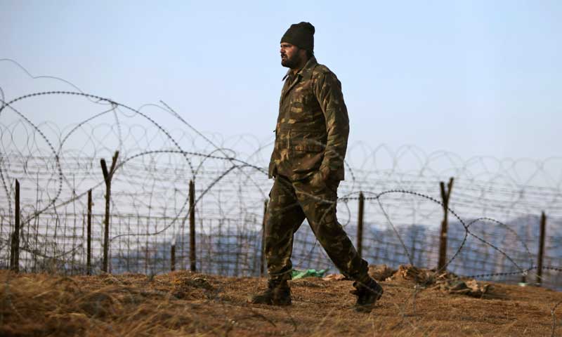 An Indian army soldier patrols near the Line of Control after reported ceasefire violation, in Mendhar, Poonch district, about 210 kilometres from Jammu. — Photo by AP/File