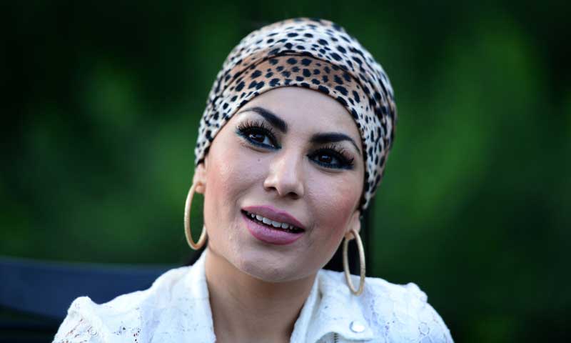 In this photograph taken on July 12, 2013, Afghan female singer Aryana Sayeed conducts an interview with AFP at Qargha lake on the outskirts of Kabul. &mdash; Photo by AFP