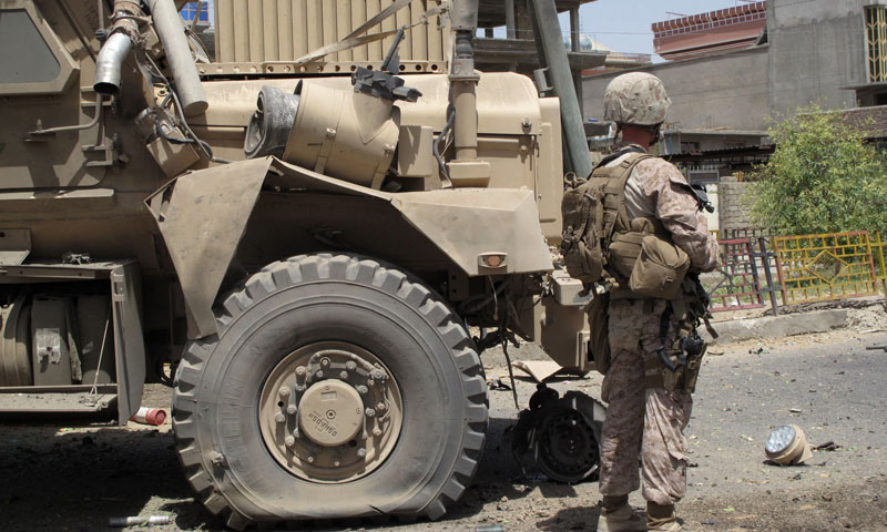 A US soldier stands guard at the site of a suicide car bombing attack in Lashkar Gah, the capital of Helmand province in southern Afghanistan on August 28, 2013.   — Photo by AFP