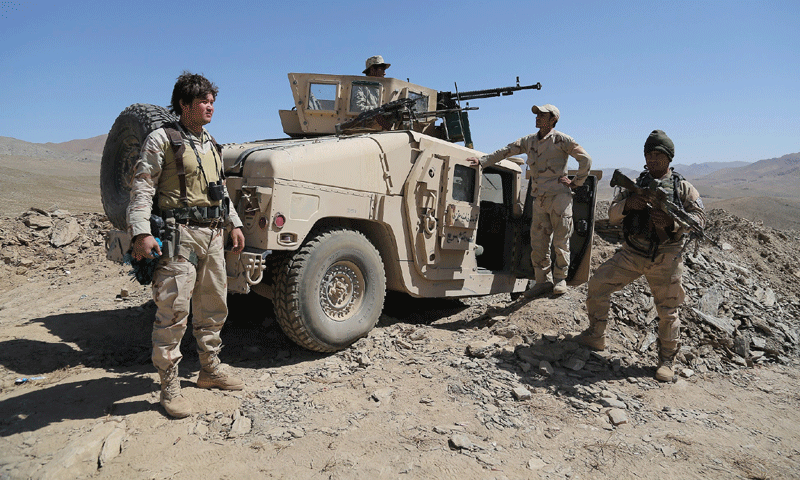 Afghan security forces stand guard in Zana Khan district in Ghazni province - Photo by AFP