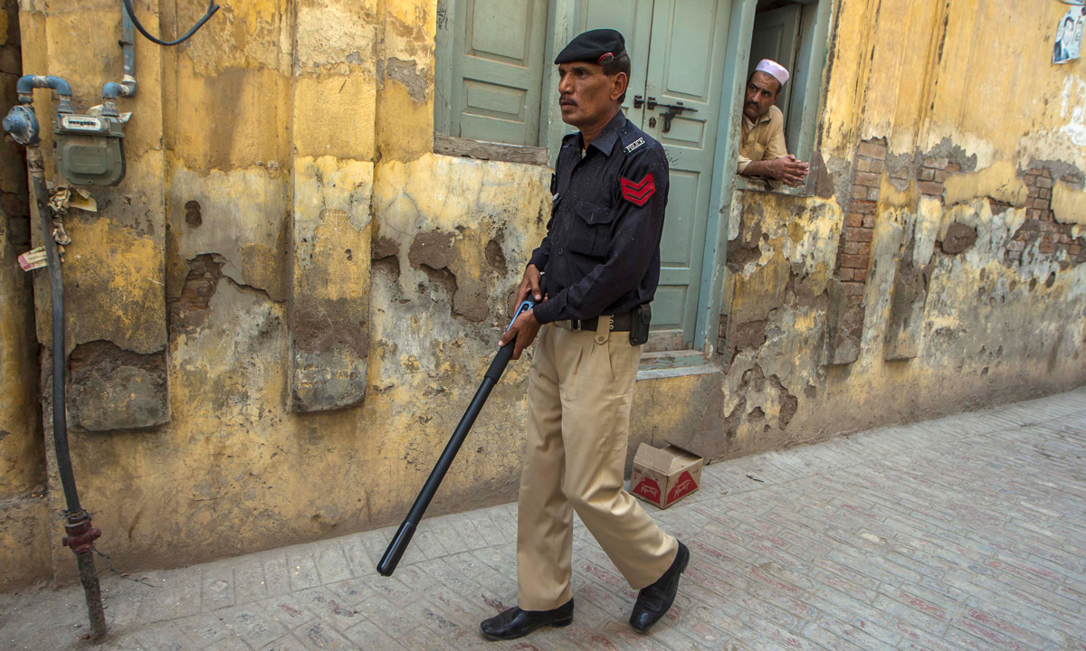 A technician from Pakistan's top bomb disposal unit holds an explosives detonator during a bomb search operation in Peshawar. &ndash; Photo by Reuters