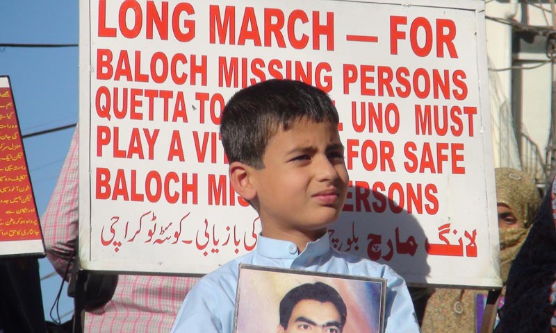 Protesters and long march participants holding slogans demanding the recovery of missing persons. -Photo by Syed Ali Shah