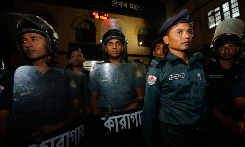 Police stand guard in front of the gate of Dhaka Central Jail. – Reuters Photo