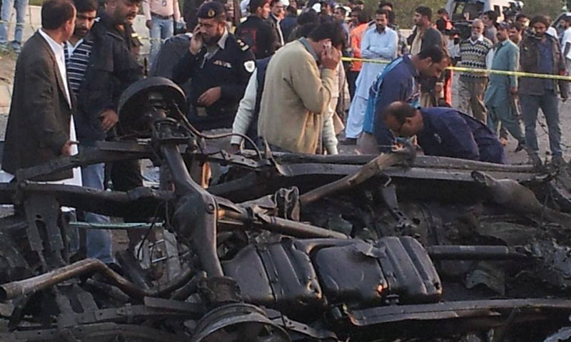 Photo shows the wreckage of slain police officer Chaudhary Aslam's vehicle after a Taliban bombing claimed his life in Karachi, Jan 9, 2014.—Photo by Asif Mehmood