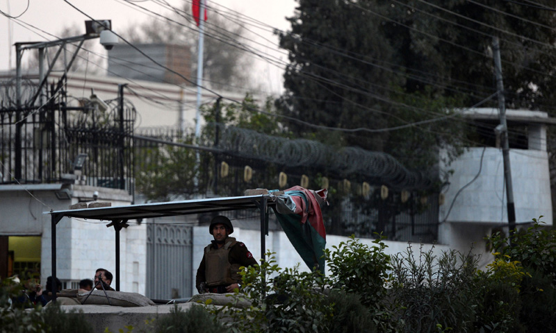 Security personnel stand guard outside the Iranian consulate following a suicide bomb attack in Peshawar on February on February 24, 2014. – AFP Photo