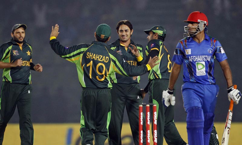 Pakistan’s Saeed Ajmal, center facing camera, celebrates the dismissal of Afghanistan’s Noor Ali Zadran with teammates during the Asia Cup one-day international cricket tournament between them in in Fatullah. -AP Photo