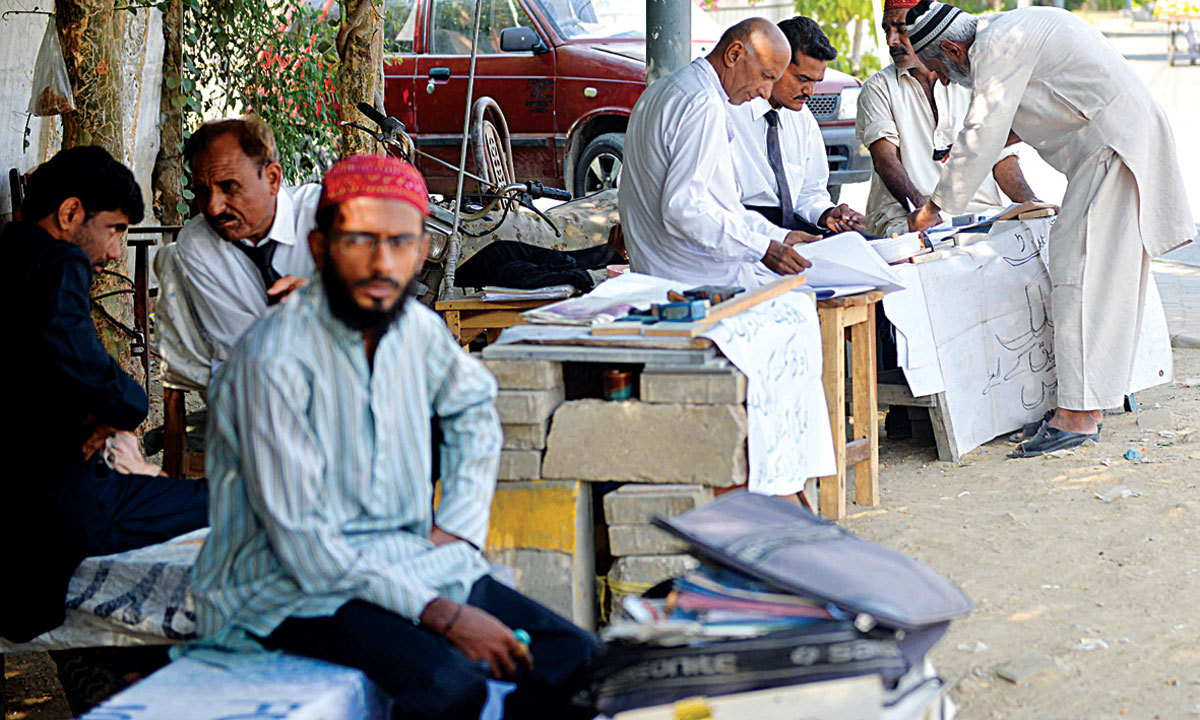 No red tape, no patwari; instant attestations on the roadside. - Photo by White Star