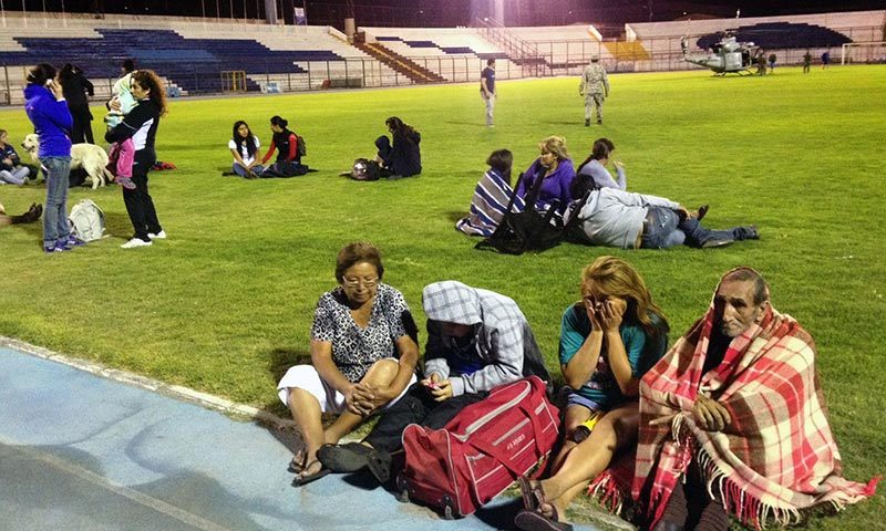 Locals take refuge at the city stadium following a tsunami alert after a powerful 8.0-magnitude earthquake hit off Chile's Pacific coast in Iquique. — Photo by AFP Locals take refuge at the city stadium following a tsunami alert after a powerful 8.0-magnitude earthquake hit off Chile's Pacific coast in Iquique. — Photo by AFP