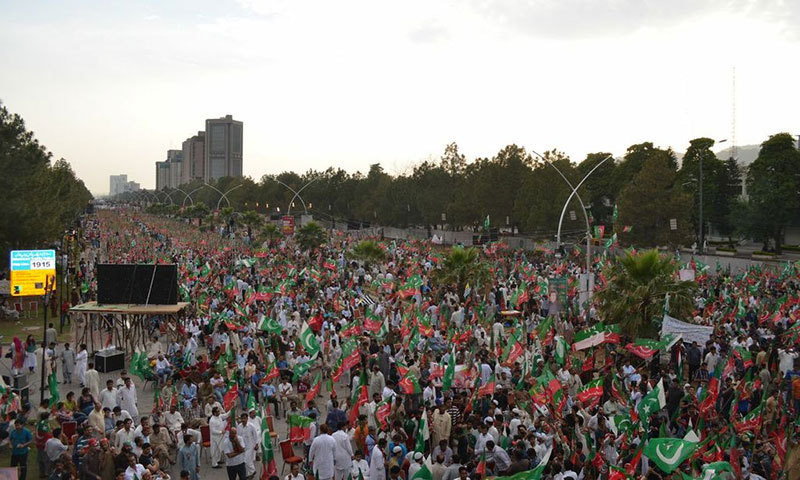 Supporters pour in at D-Chowk in Islamabad for protest rally by Pakistan Tehreek-i-Insaf (PTI) against alleged rigging in the 2013 general elections.—Photo by Irfan Haider