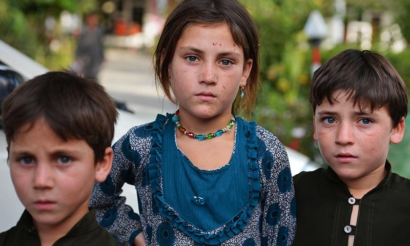 Pakistan children whose families fled North Waziristan tribal region pose for a photograph in Bannu. — Photo by AFP