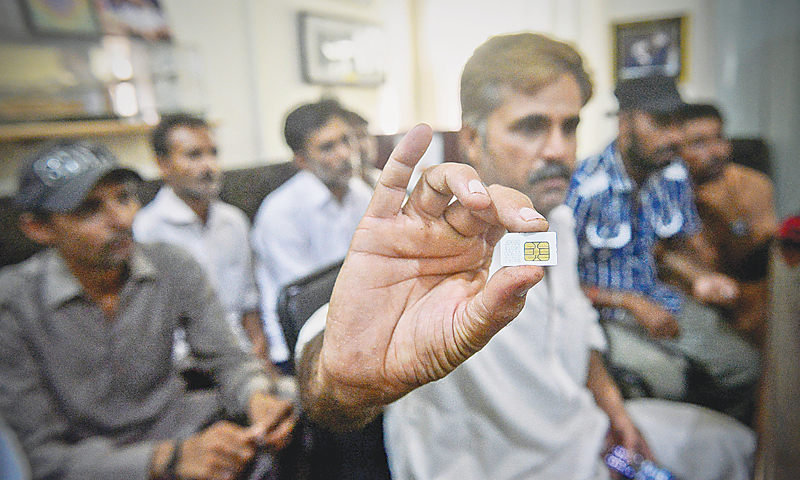 Feroze Bhatti shows the SIM that he managed to hide while being trapped in Somaliland. It was used to make a call back home for rescue. —Fahim Siddiqi / White Star