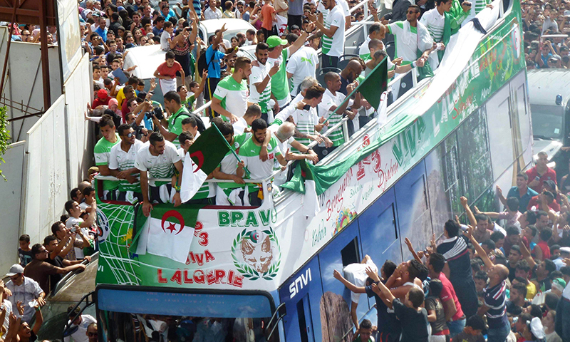 Algerian national team players are greeted by fans upon their return from the 2014 FIFA World Cup in Brazil. &mdash; Photo by AFP