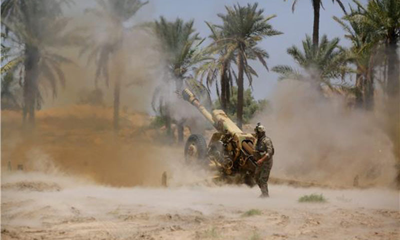 Iraqi security forces fire artillery during clashes with ISIS. — File photo by Reuters