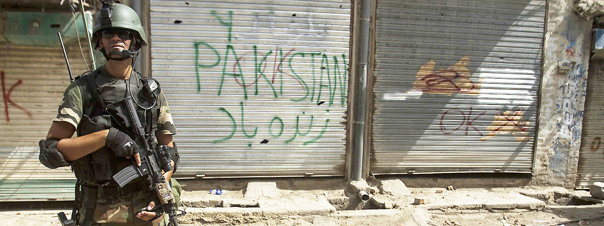 A soldier stands in front of closed shops during a military operation in the town of Miramshah. — Photo by Reuters