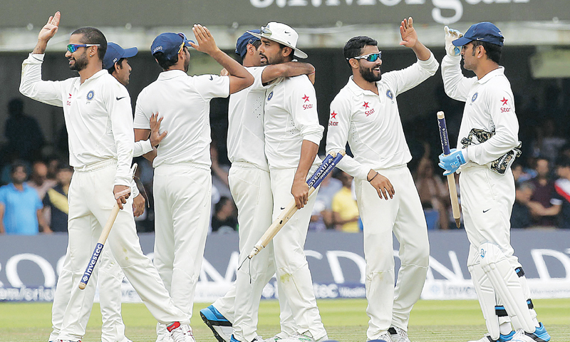 Indian players celebrate after winning the match.—AFP 
