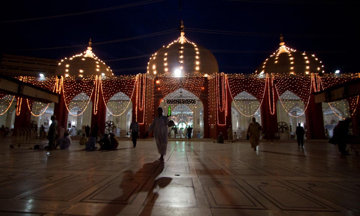 Visitors leave the mosque after the prayer and Iftar.